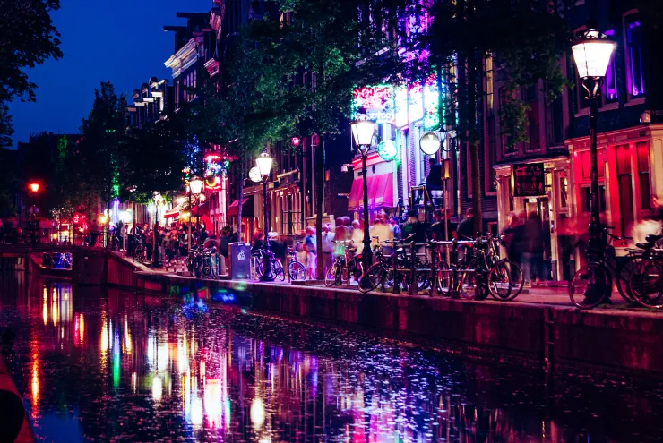 Royalty free image by Eva Carre, downloaded from Abode Stock Red lights on the canals of the Amsterdam red light district by Eva Carre